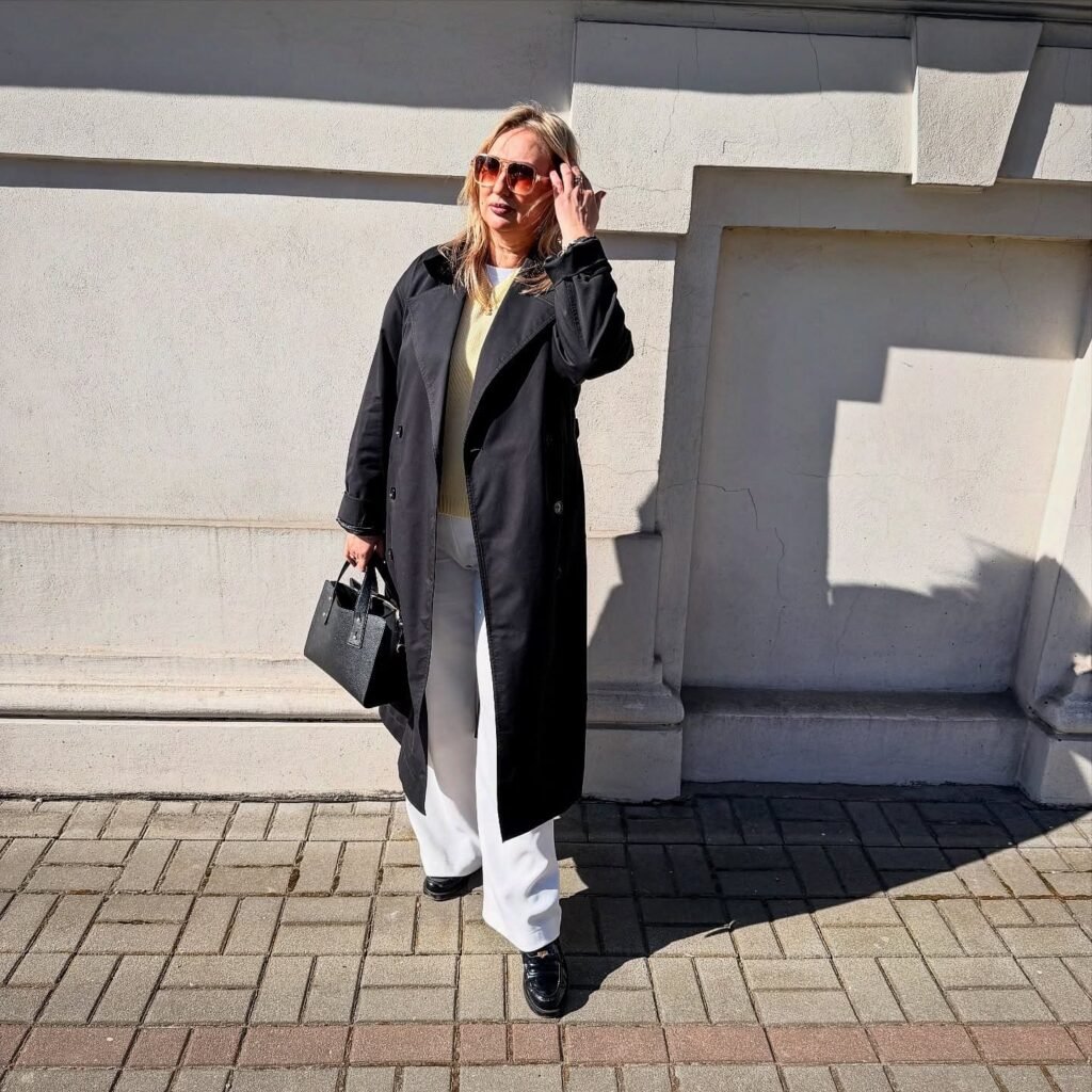 Soften a Black Trench Coat With Cream and White Layers