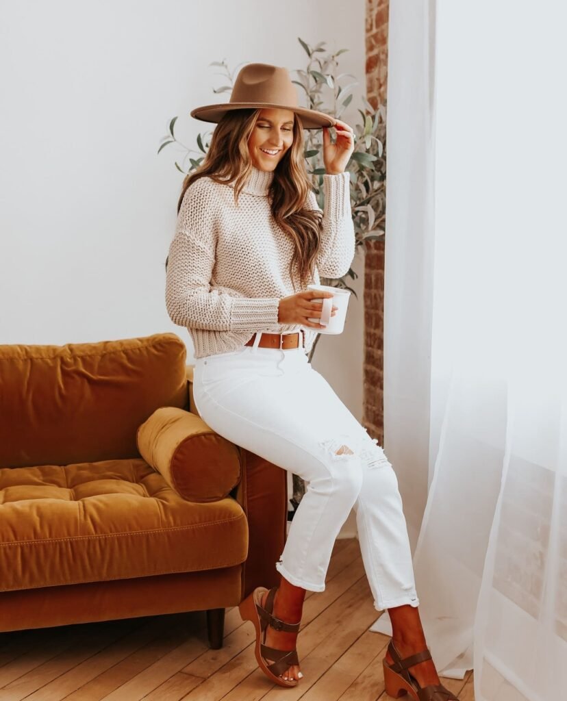 Wear Distressed White Jeans With a Chunky Cream Sweater