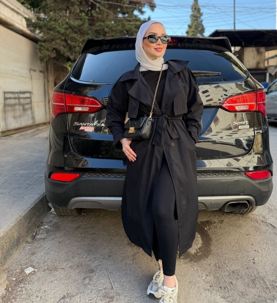 Wear a Belted Black Trench Coat With Sporty Basics