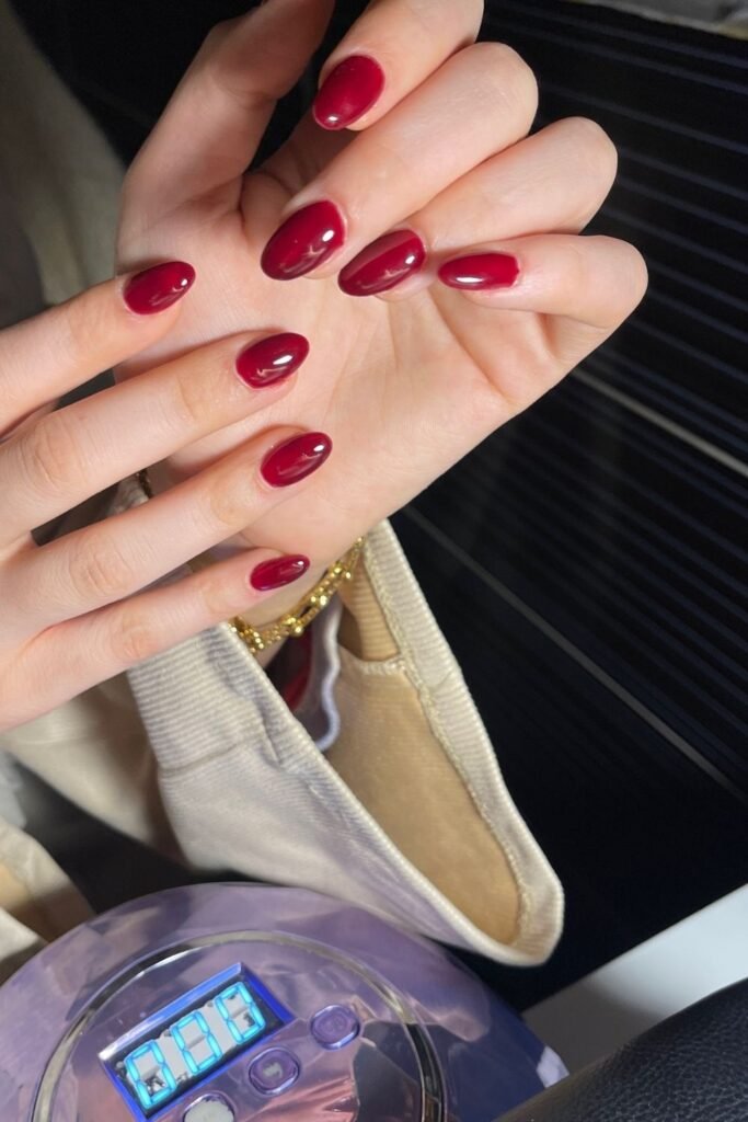 A Deep Cherry Red on Oval Nails Is the Shade That Always Looks Intentional