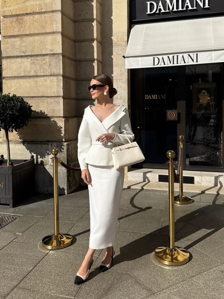All-White Skirt Suit With Black Cap-Toe Pumps