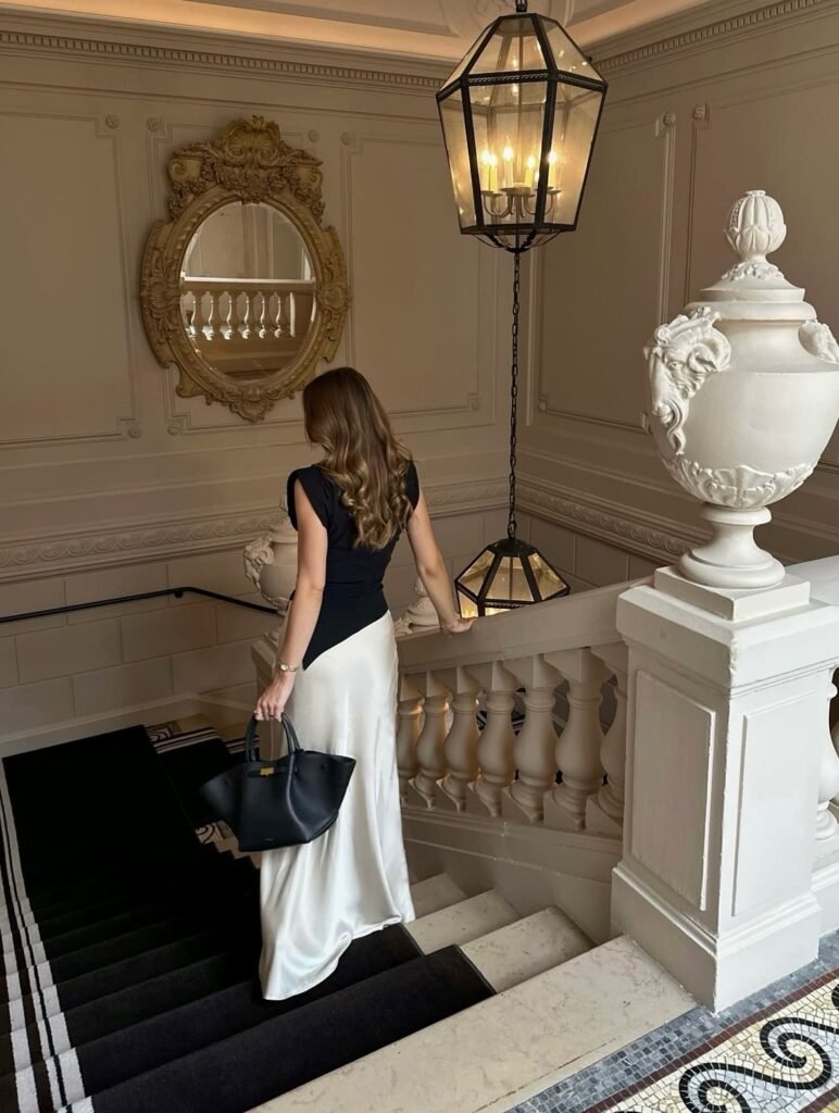 Black Sleeveless Top With a Flowing White Maxi Skirt