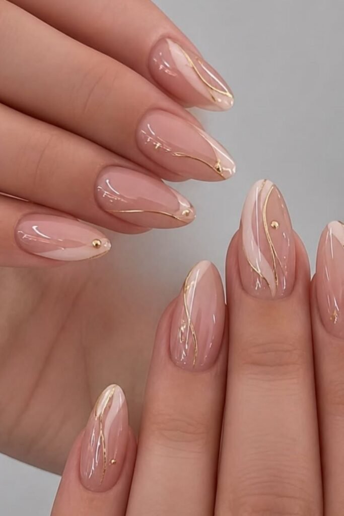 Blush Almond Nails With Flowing Gold Lines