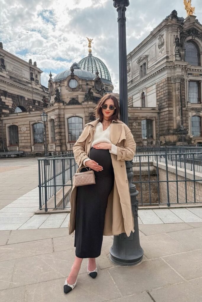 Camel Trench Over a Cream Knit and Black Fitted Skirt