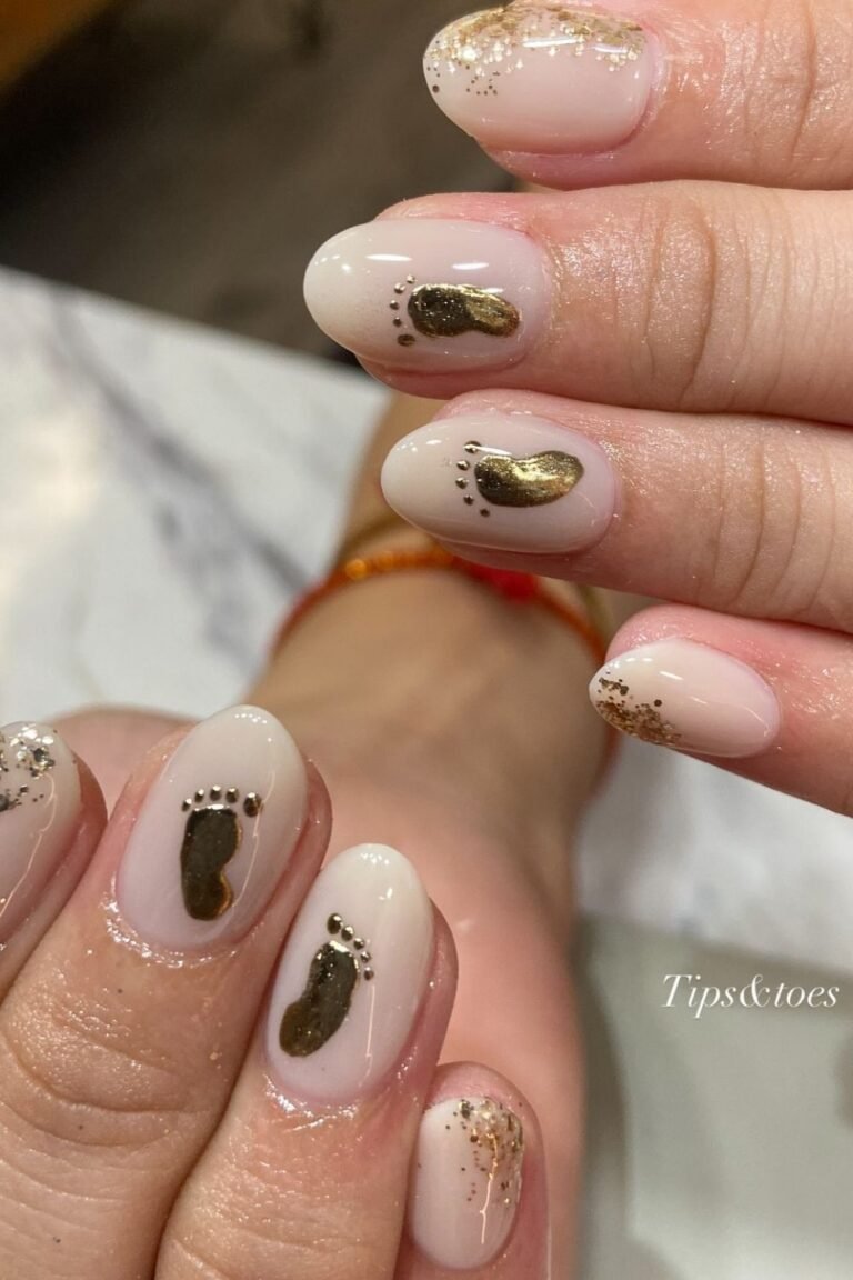 Gold Baby Footprint Nails on a Soft Nude Base