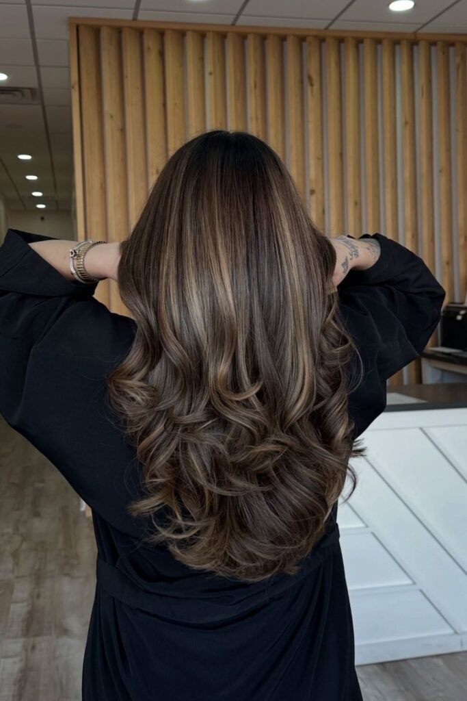 Golden Caramel Money Pieces Through Long Dark Hair