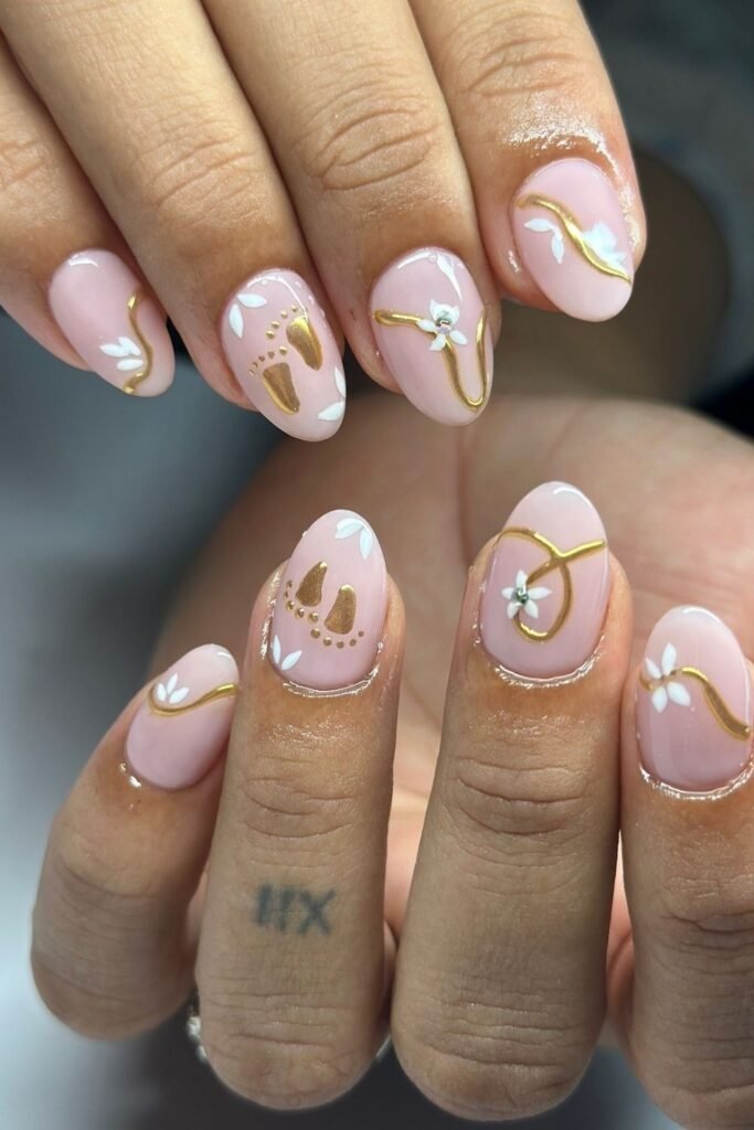 Mixing Gold Footprints with White Florals for a Layered Baby Shower Set