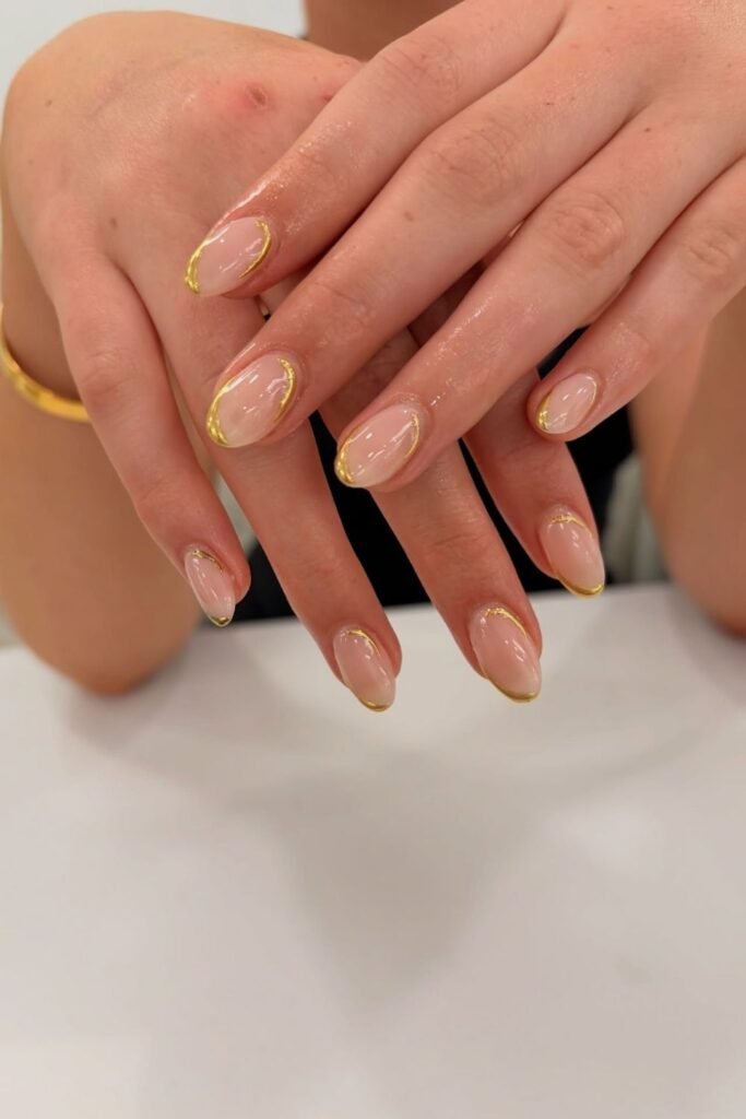 Nude Nails With Fine Gold Outline Tips