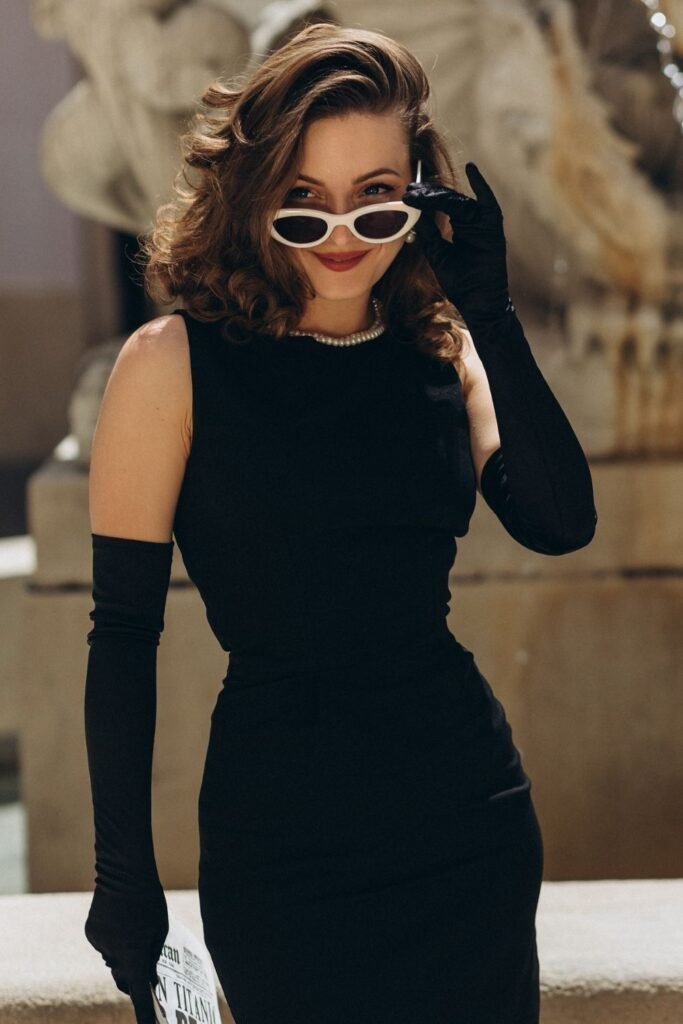 Opera Gloves and White Frame Sunglasses Over a Black Shift