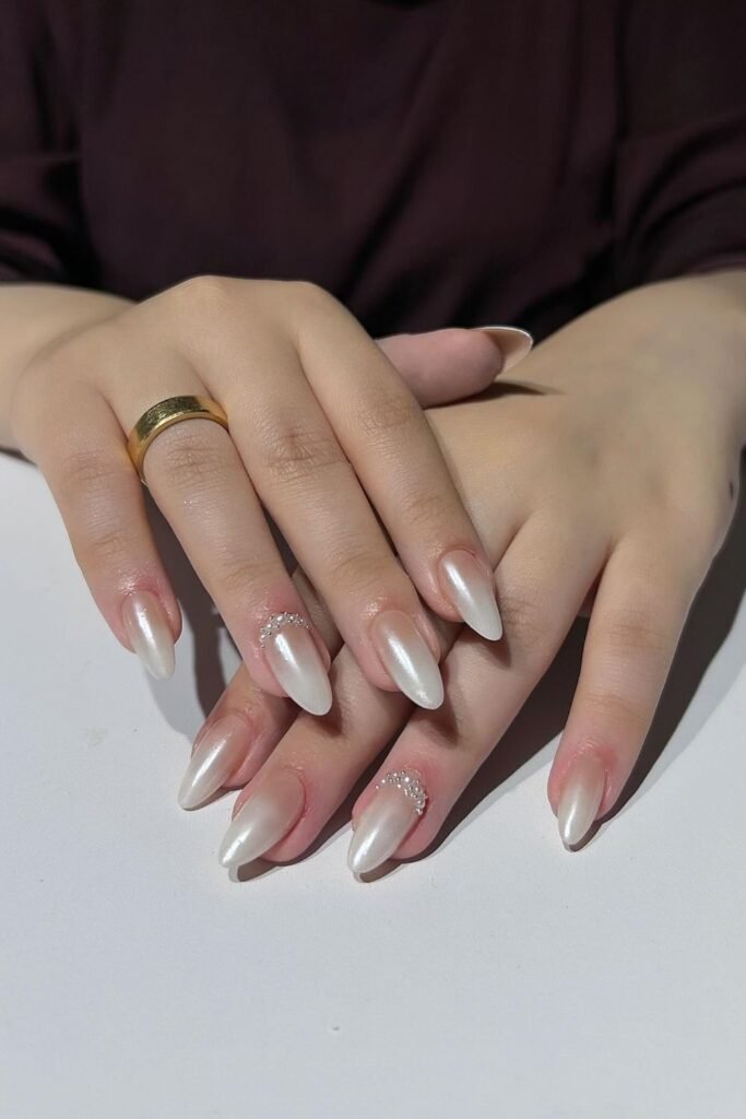 Pearly White Almond Nails With Delicate Rhinestones