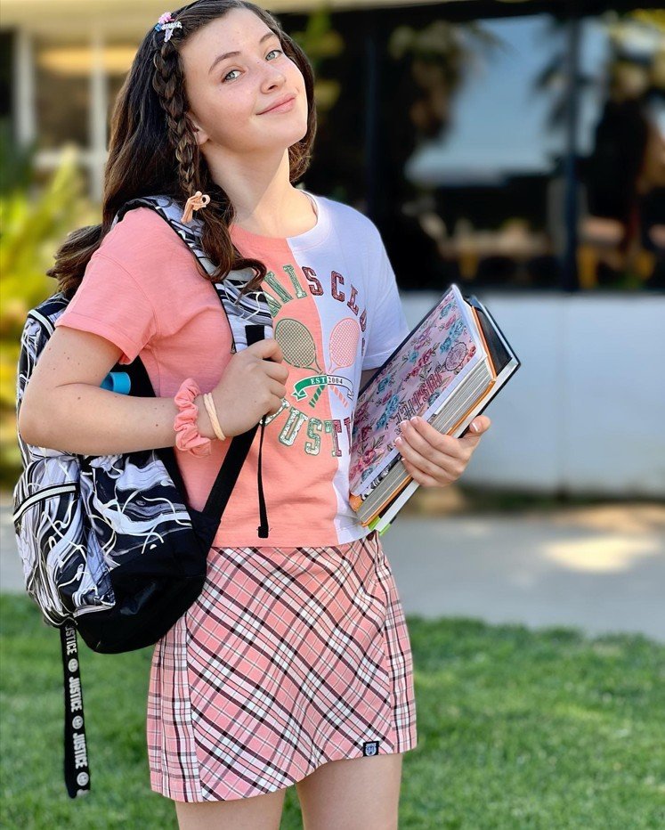Pink Plaid Skirt With a Sporty Graphic Tee