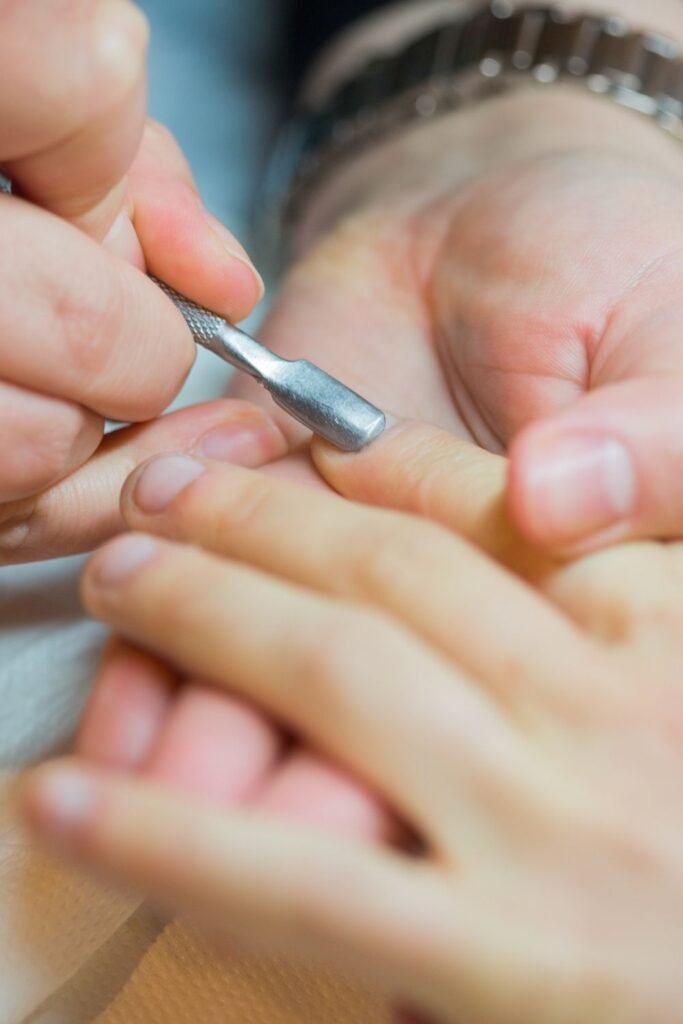 Push back your cuticles to expose more nail bed