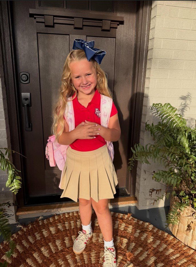 Red Polo and Khaki Pleated Skirt With Playful Accessories