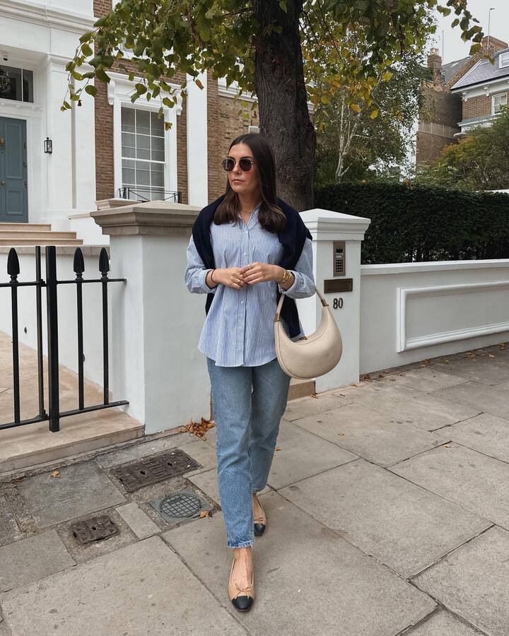 Striped Shirt With a Sweater Draped Over Mom Jeans