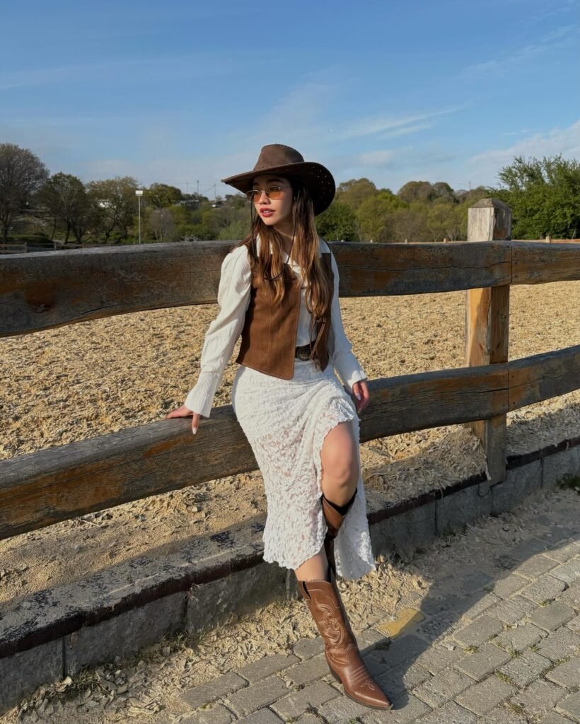 Suede Vest Over a White Lace Midi Dress