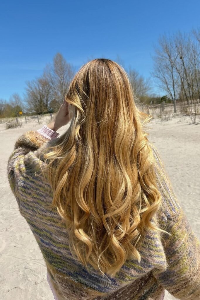 Sun Lightened Golden Blonde With Visible Roots