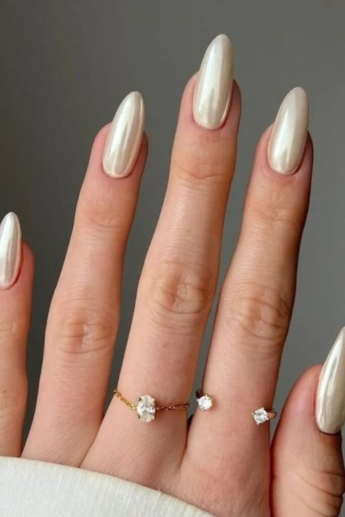 Warm Greige Nails With Gold Stacking Rings