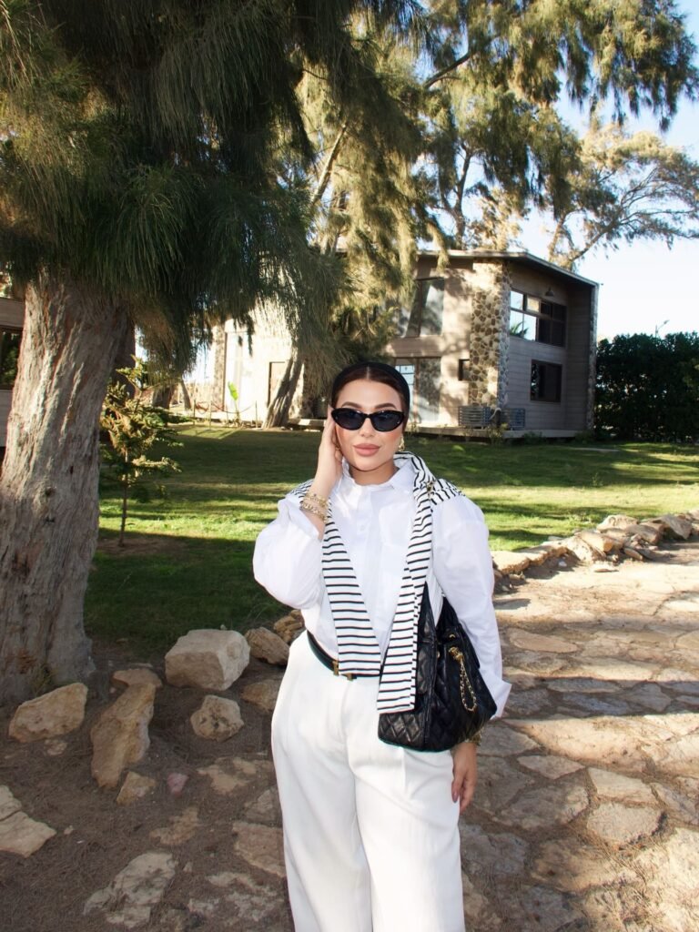 White Tailoring With a Striped Knit Over the Shoulders