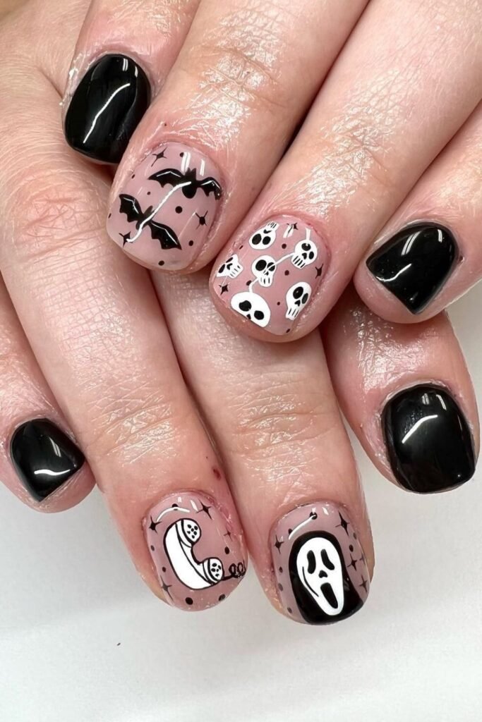 Black Halloween Collage Nails With Bats, Skulls, and Ghostface