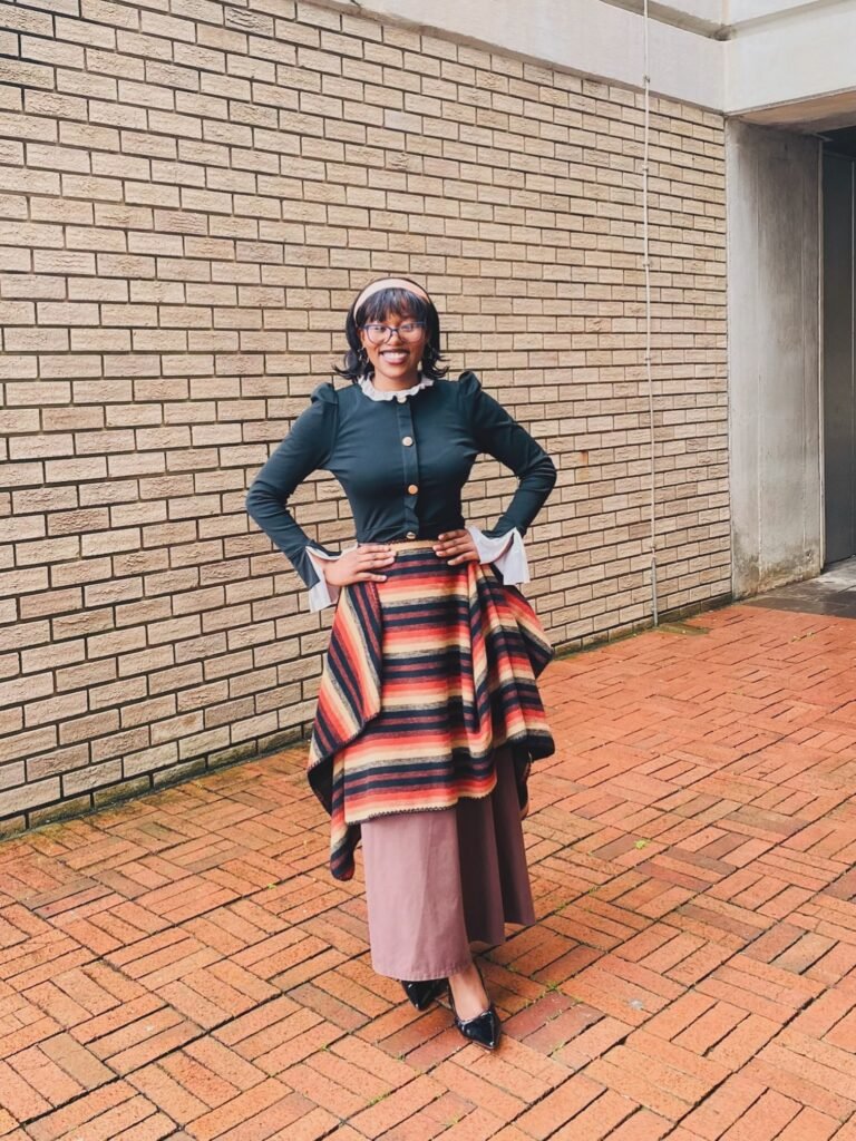 Black Ruffle Jacket With a Layered Striped Skirt