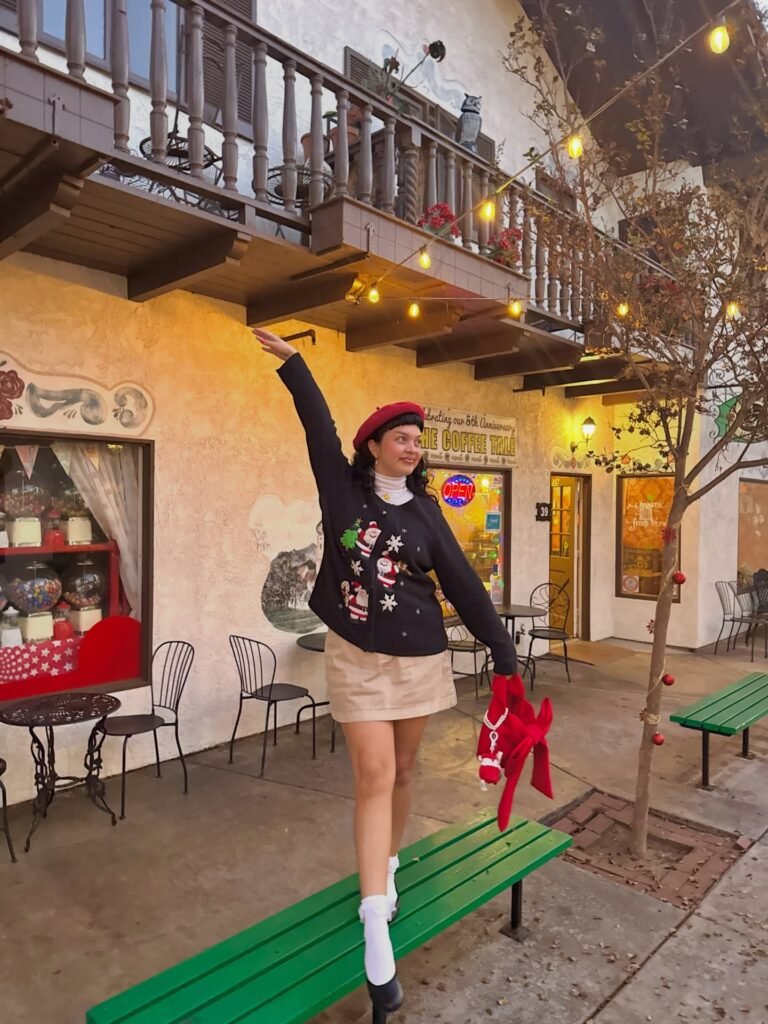 Black Santa Sweater With a Beige Mini Skirt