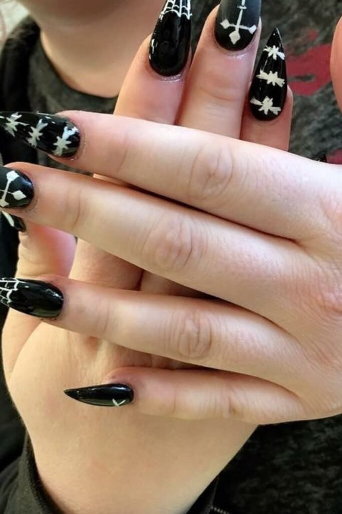 Black Stiletto Nails With White Webs and Cross Details