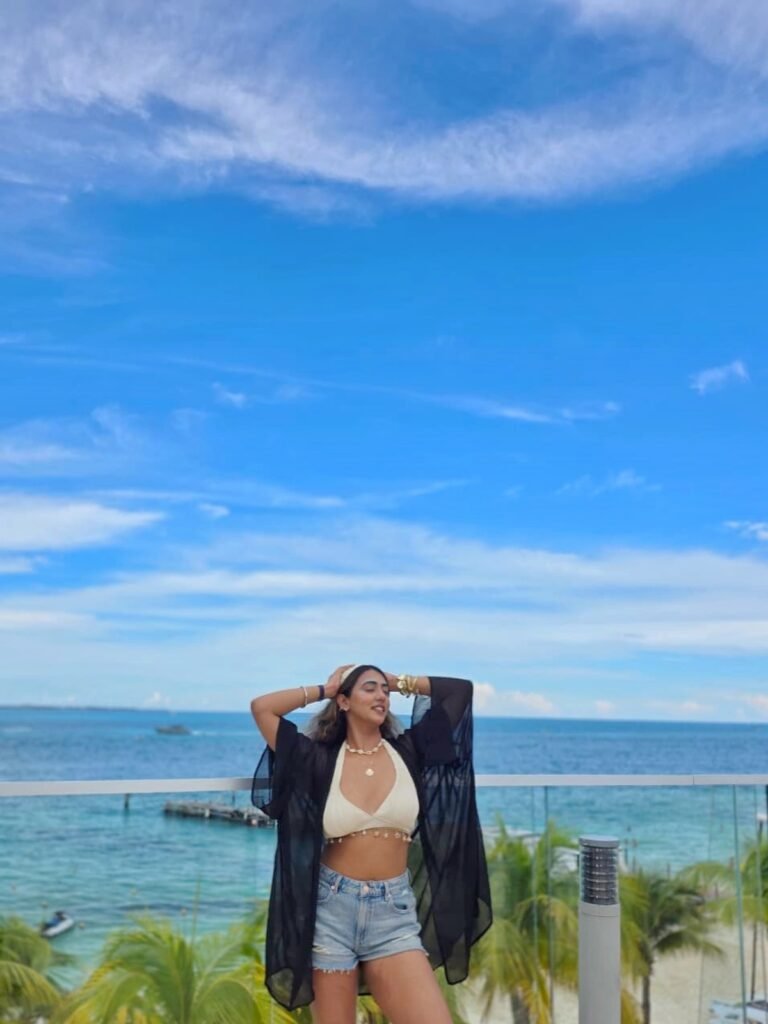 Denim Shorts With a Cream Halter and Sheer Black Cover Up