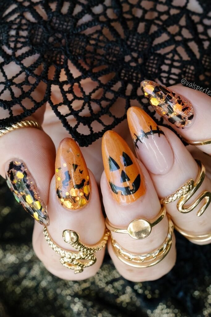Glitter Jack-o’-Lantern Almond Nails With Orange Jelly Tips