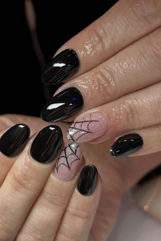 Glossy Black Nails With Sheer Spiderweb Accents