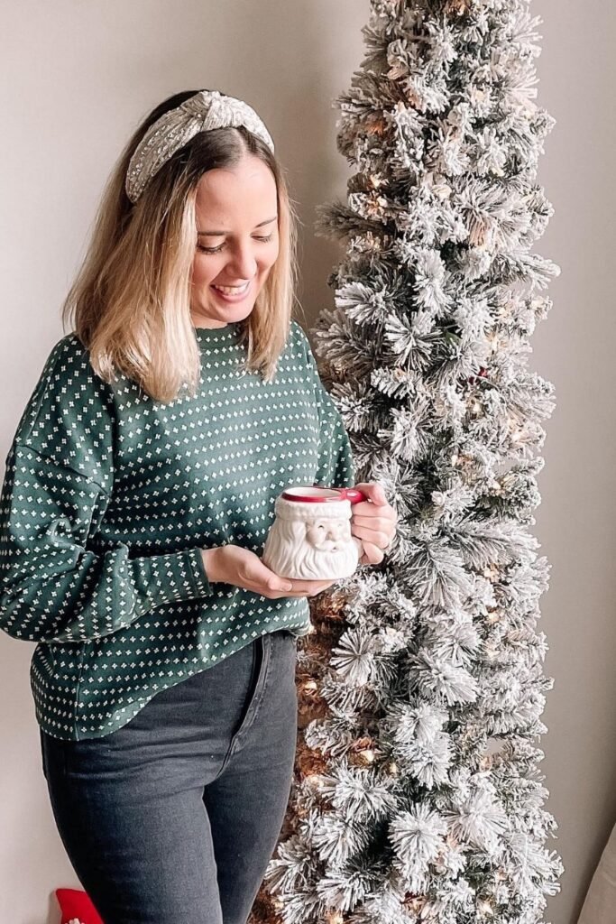 Green Holiday Sweater With Dark Jeans for a Cozy Dinner at Home