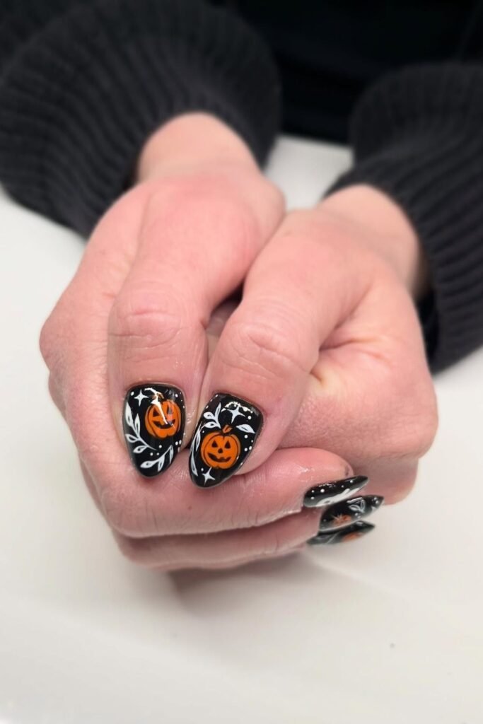 Hand Painted Jack O'Lanterns Over Glossy Black