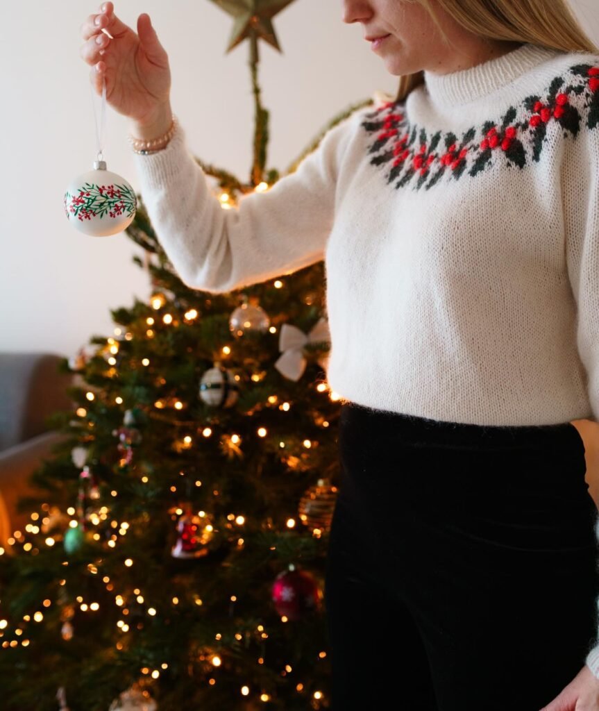 Holly Christmas Sweater With a Black Skirt