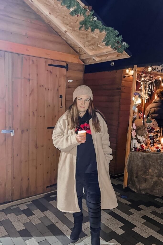 Long Cream Teddy Coat With a Knit Beanie