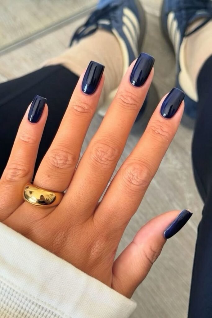 Long Square Navy Nails With a Gold Dome Ring