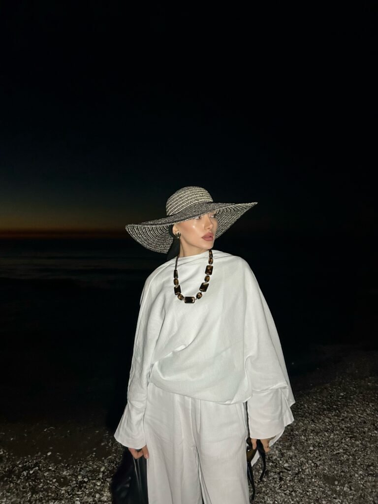 Loose White Layers With a Wide Brim Beach Hat