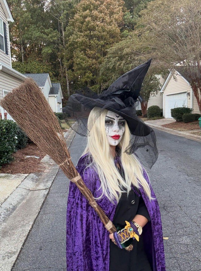 Purple Velvet Witch With a Dramatic Black Hat