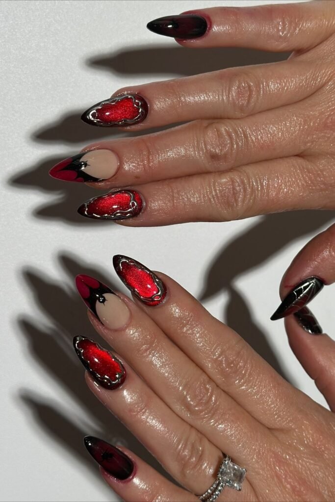 Red Cat Eye Nails With Gothic Metal Frames