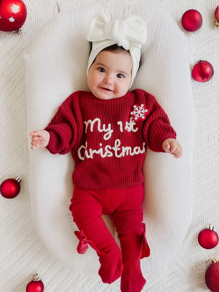 Red First Christmas Knit With a Big White Bow