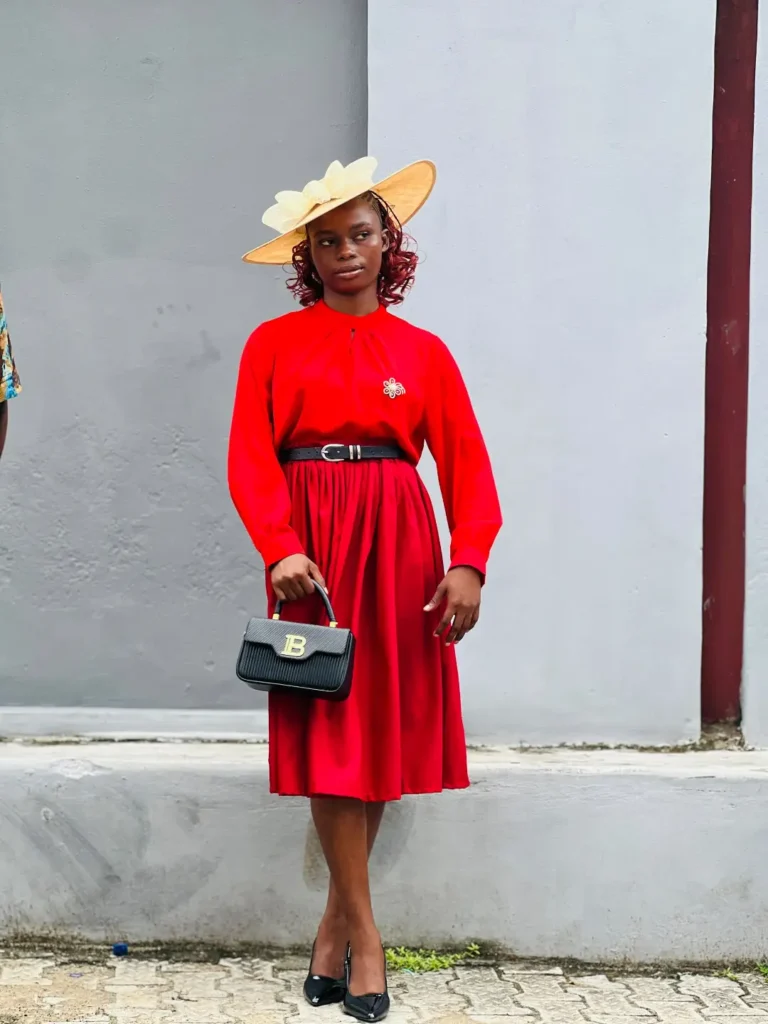 Red Midi Dress With a Black Belt and Classic Pumps