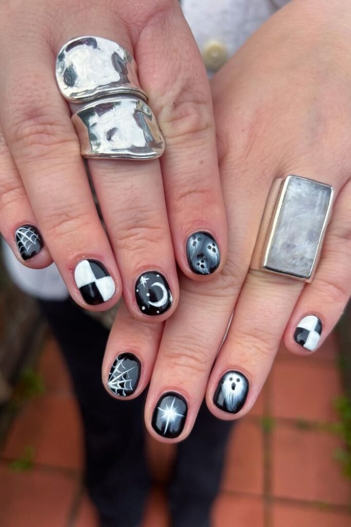 Short Black Halloween Nails With Ghosts, Webs, and Moons