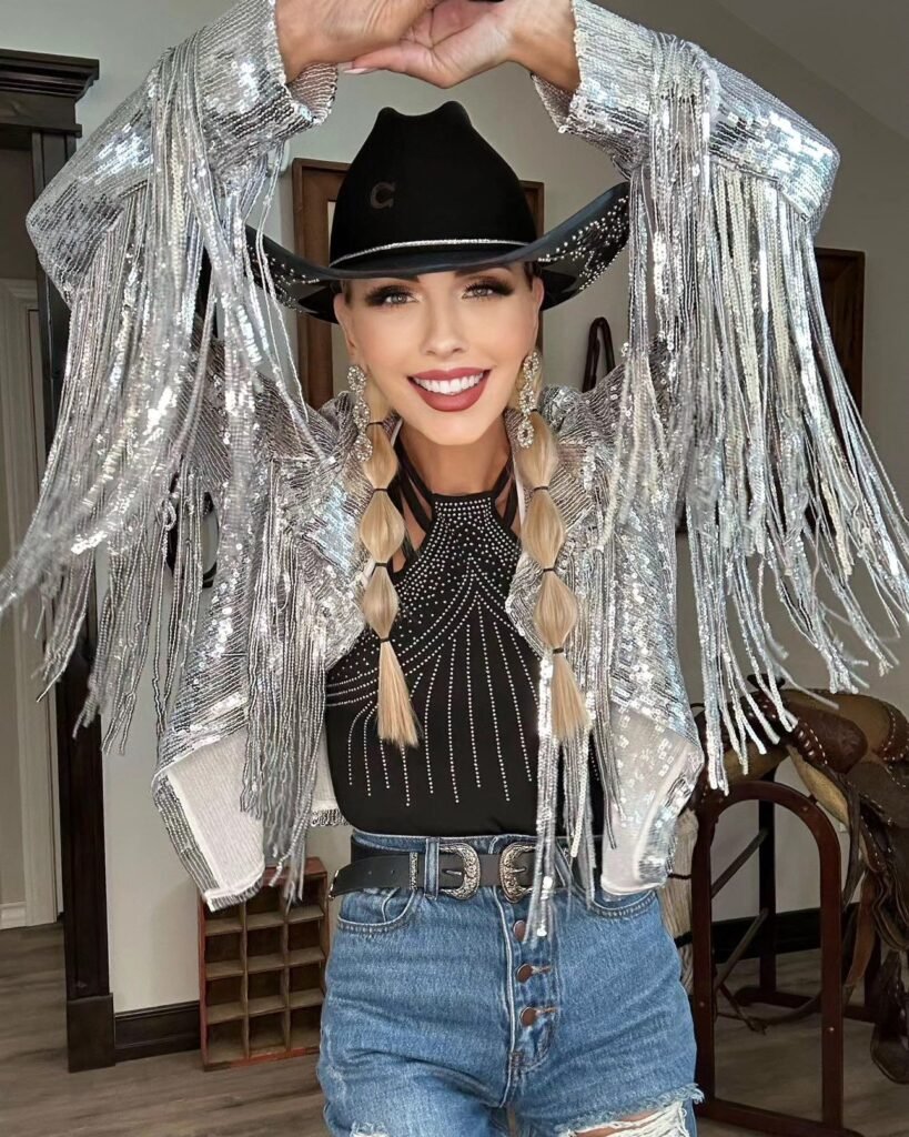 Silver Fringe Jacket and a Black Cowboy Hat