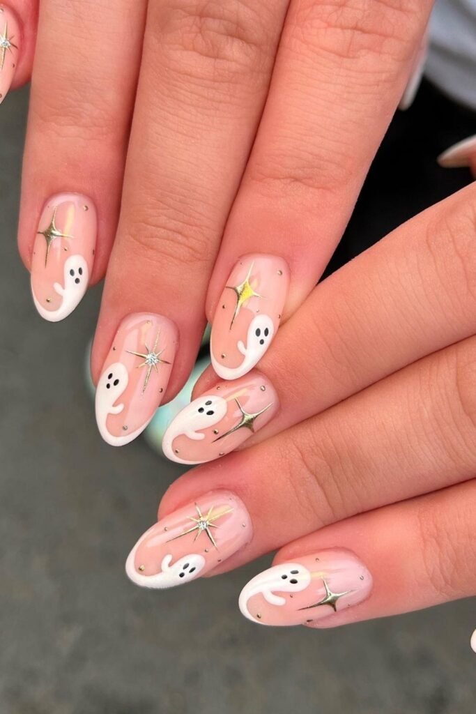 Soft Pink Ghost Nails With Golden Stars