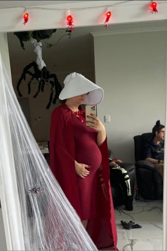 Handmaid Costume for a Dark Minimal Pregnancy Look