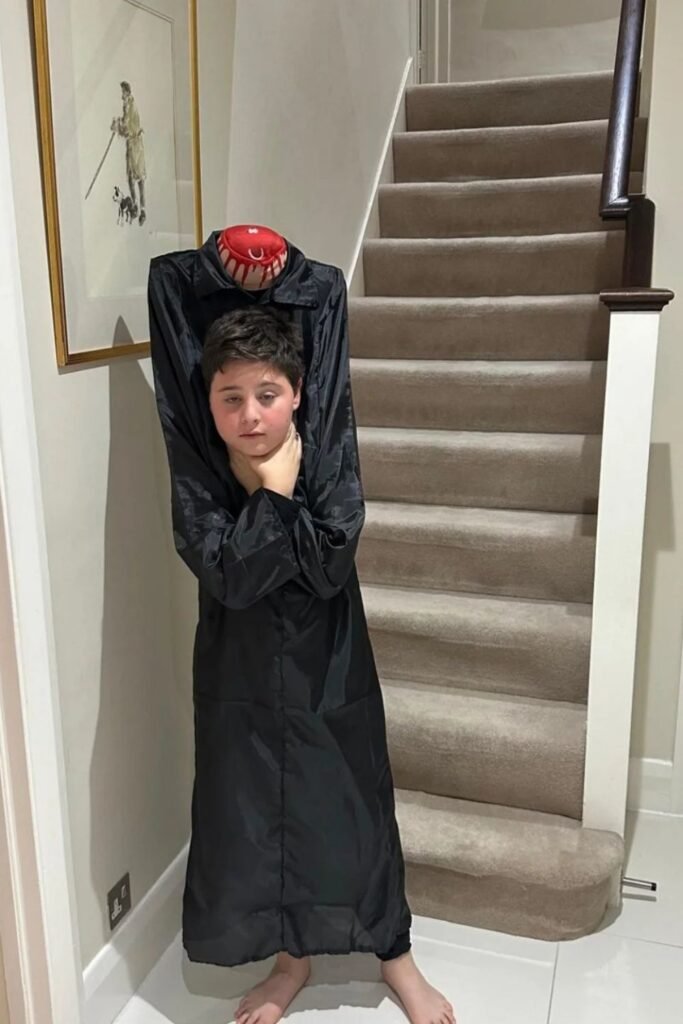 The Headless Illusion Made From One Oversized Coat
