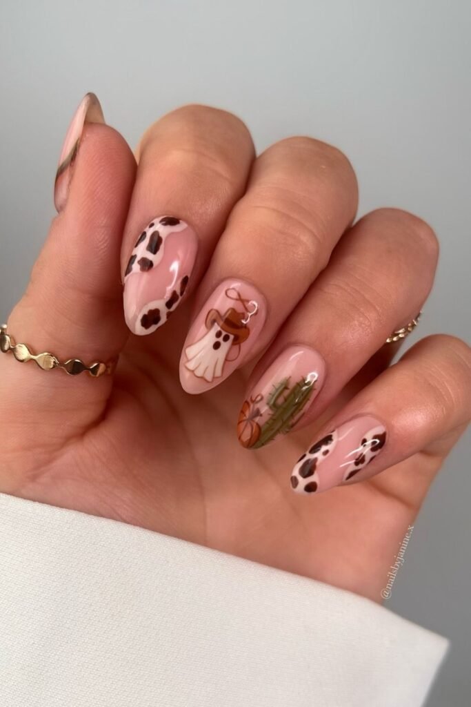 Western Halloween Almond Nails With Cow Print and Cowboy Ghosts