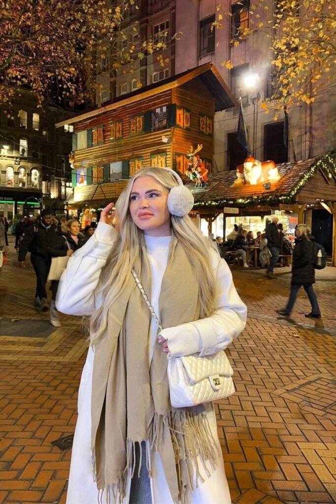 Winter White Layers With a Beige Scarf and Earmuffs