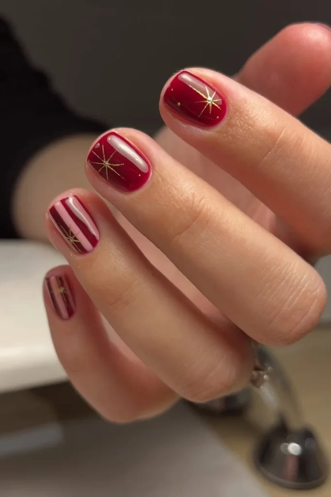Short Red Christmas Nails With Gold Starbursts