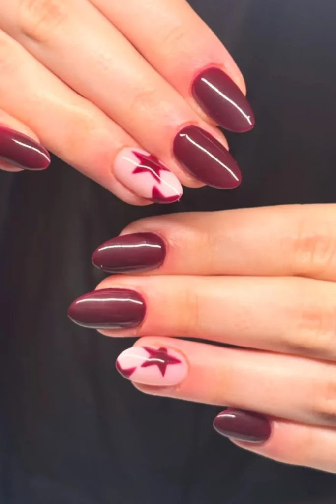 Burgundy Nails With a Single Star Accent