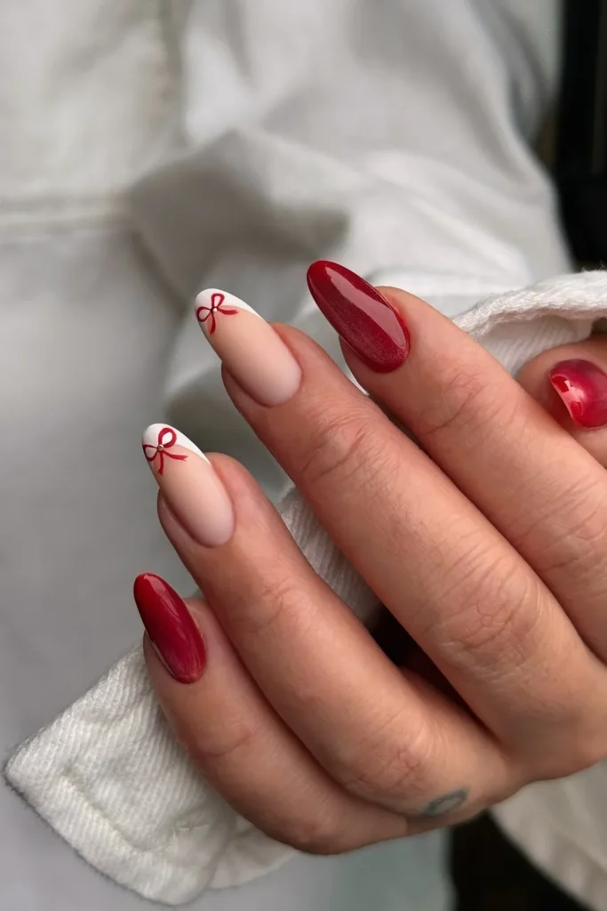 Red Bow French Tips on Long Almond Nails