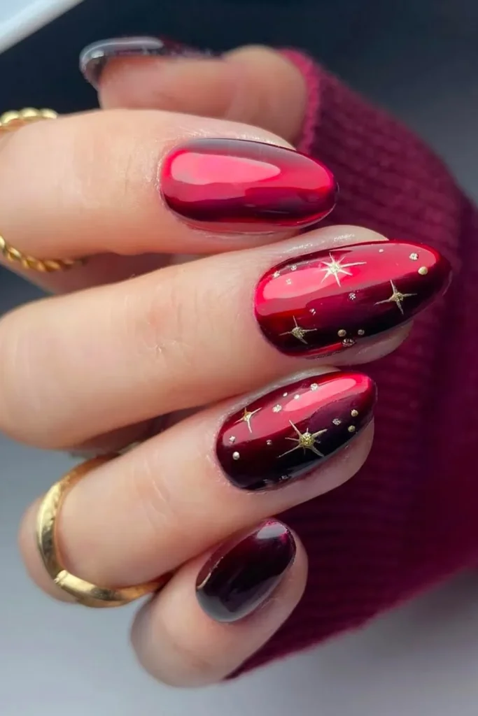 Red and Gold Christmas Nails With an Aura Glow